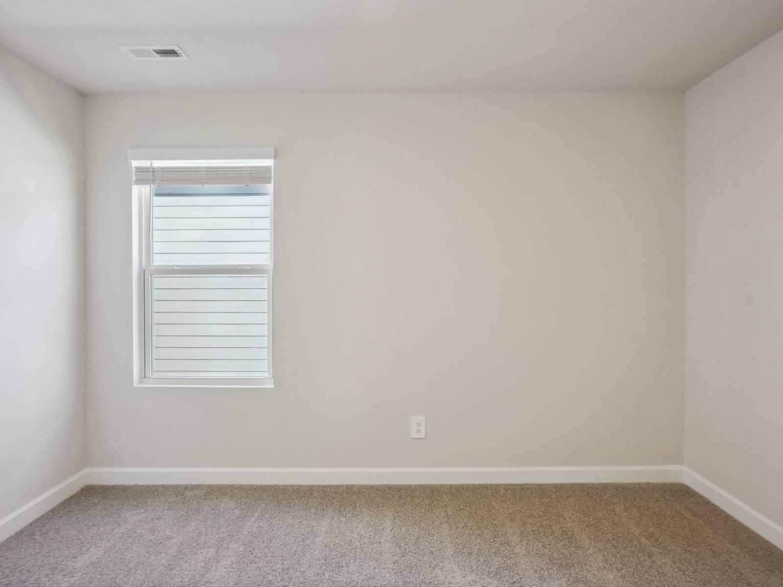 The downstairs secondary bedroom is perfect for guests.