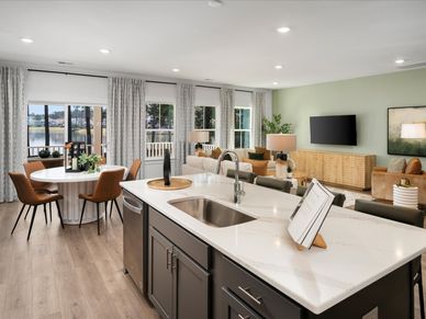 The well-appointed kitchen features a large island to make meal prep a breeze.