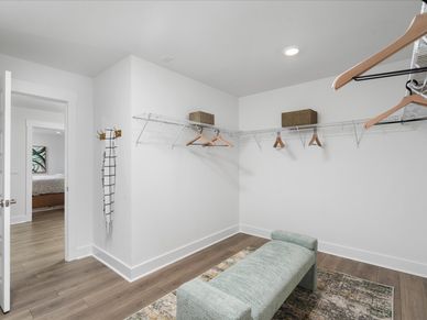The walk-in closet off of the primary bathroom offers an abundance of space.
