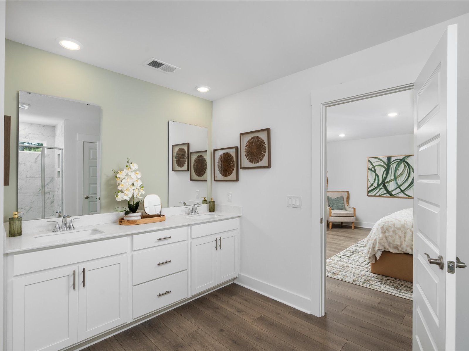 The primary ensuite boasts duel sinks, tile shower and large walk-in closet.