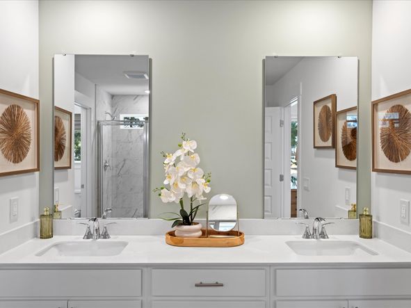 The primary ensuite boasts duel sinks, tile shower and large walk-in closet.