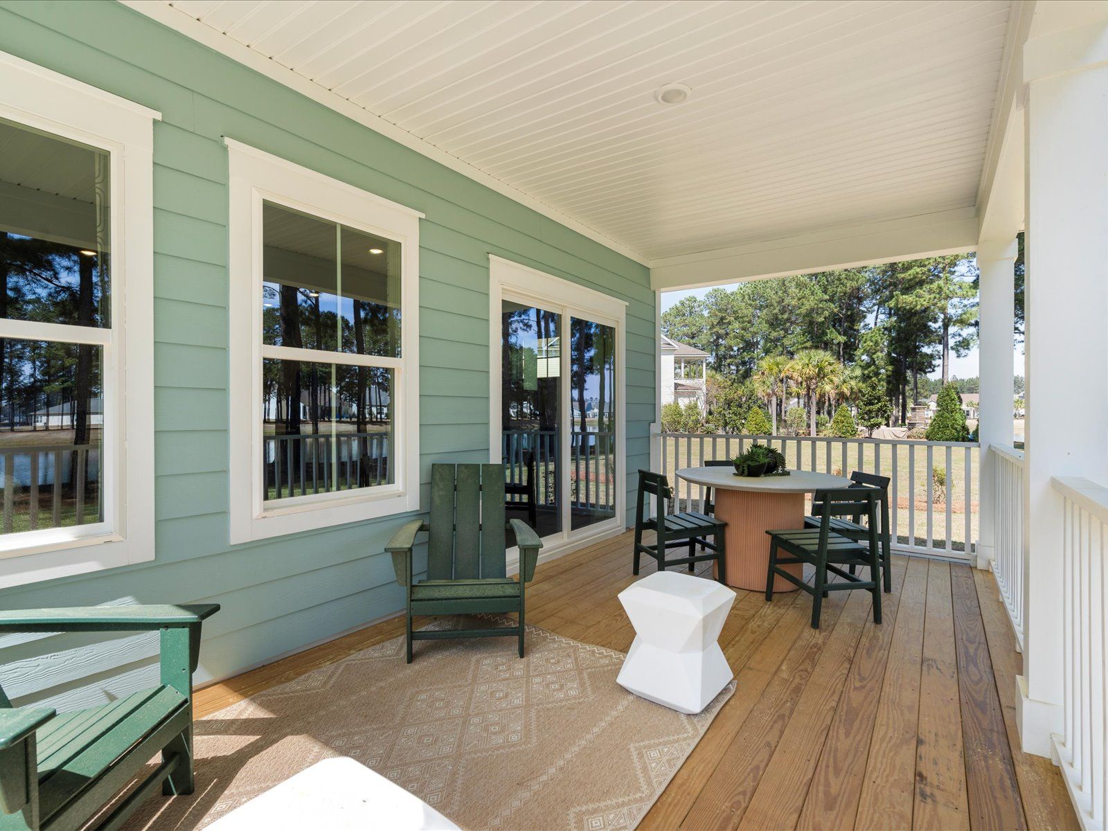 A covered rear deck is a great spot for relaxing outdoors.