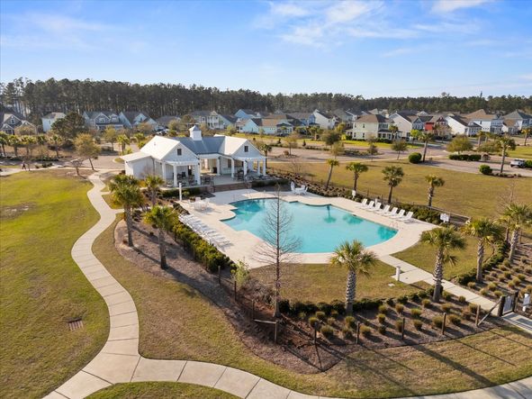 Relax by the community pool and enjoy the scenic beauty that surrounds the amenity center.
