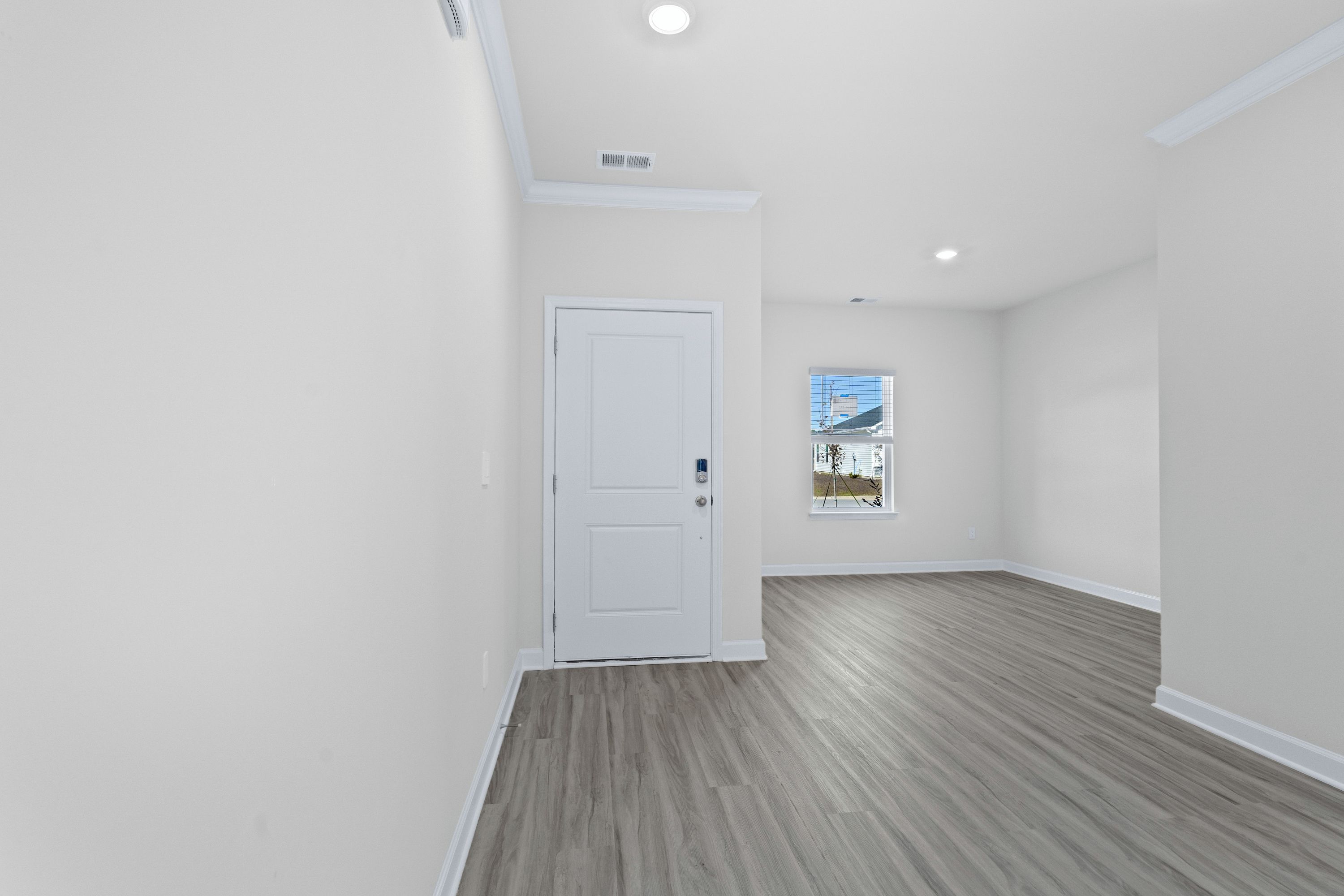 The foyer opens up to a flex space or home office