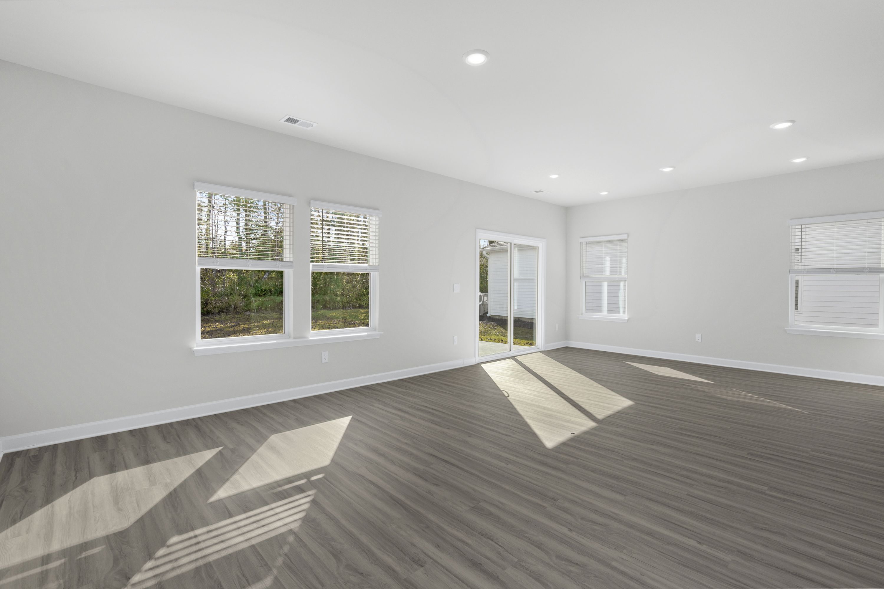 The open-concept living space is accentuated with plenty of natural light.