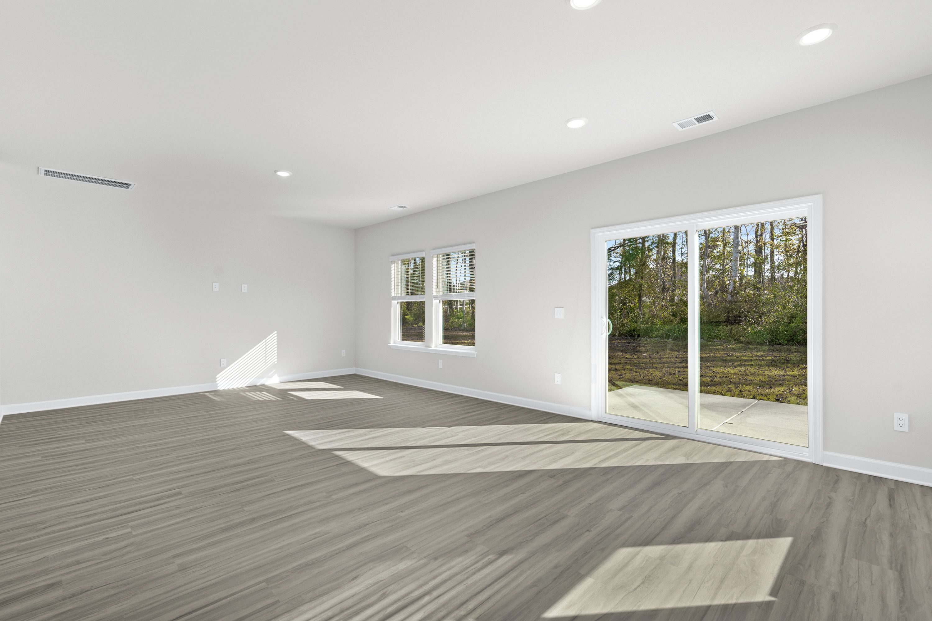 The open-concept living space is accentuated with plenty of natural light.
