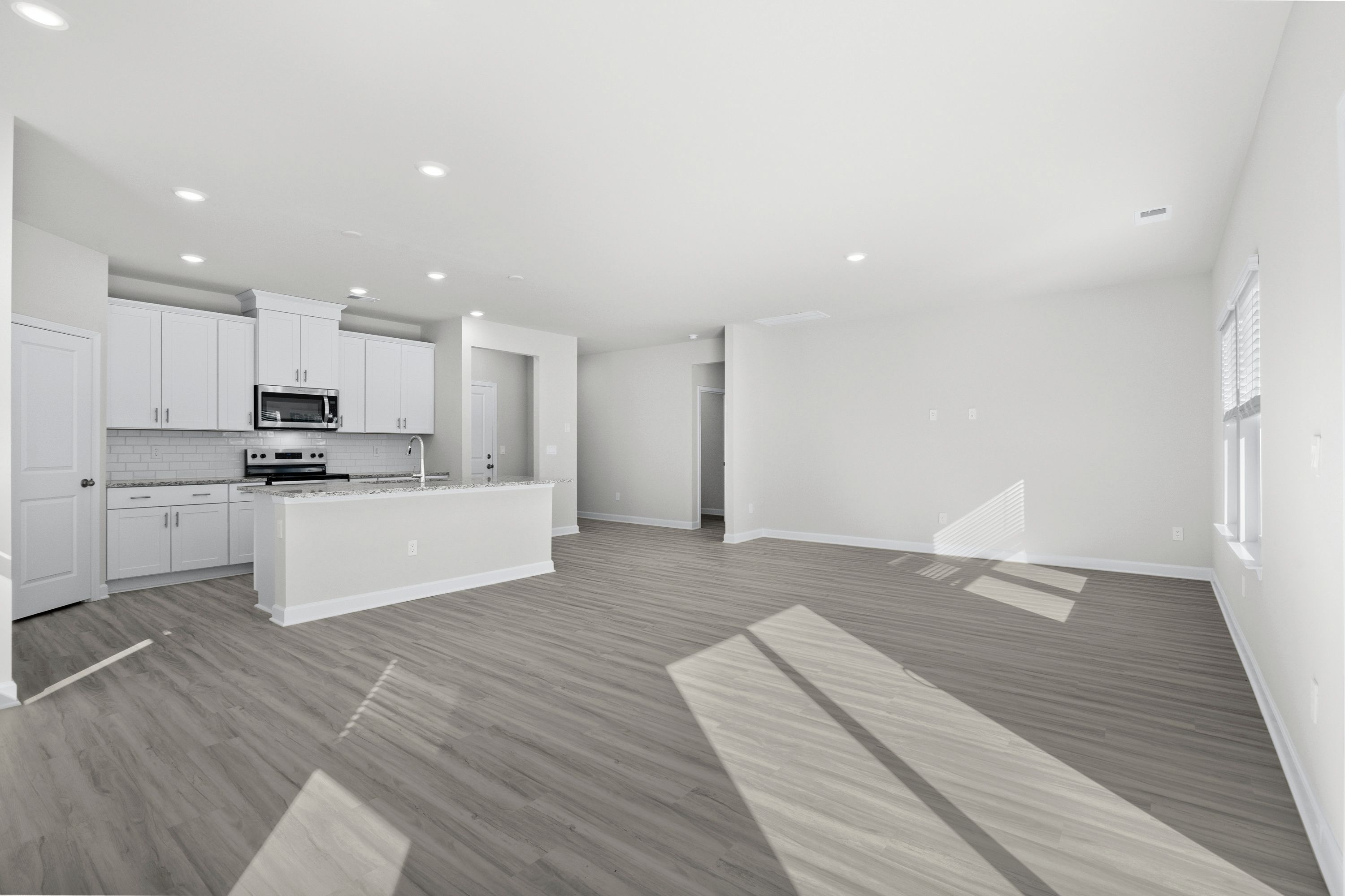 The kitchen overlooks the dining area and great room.