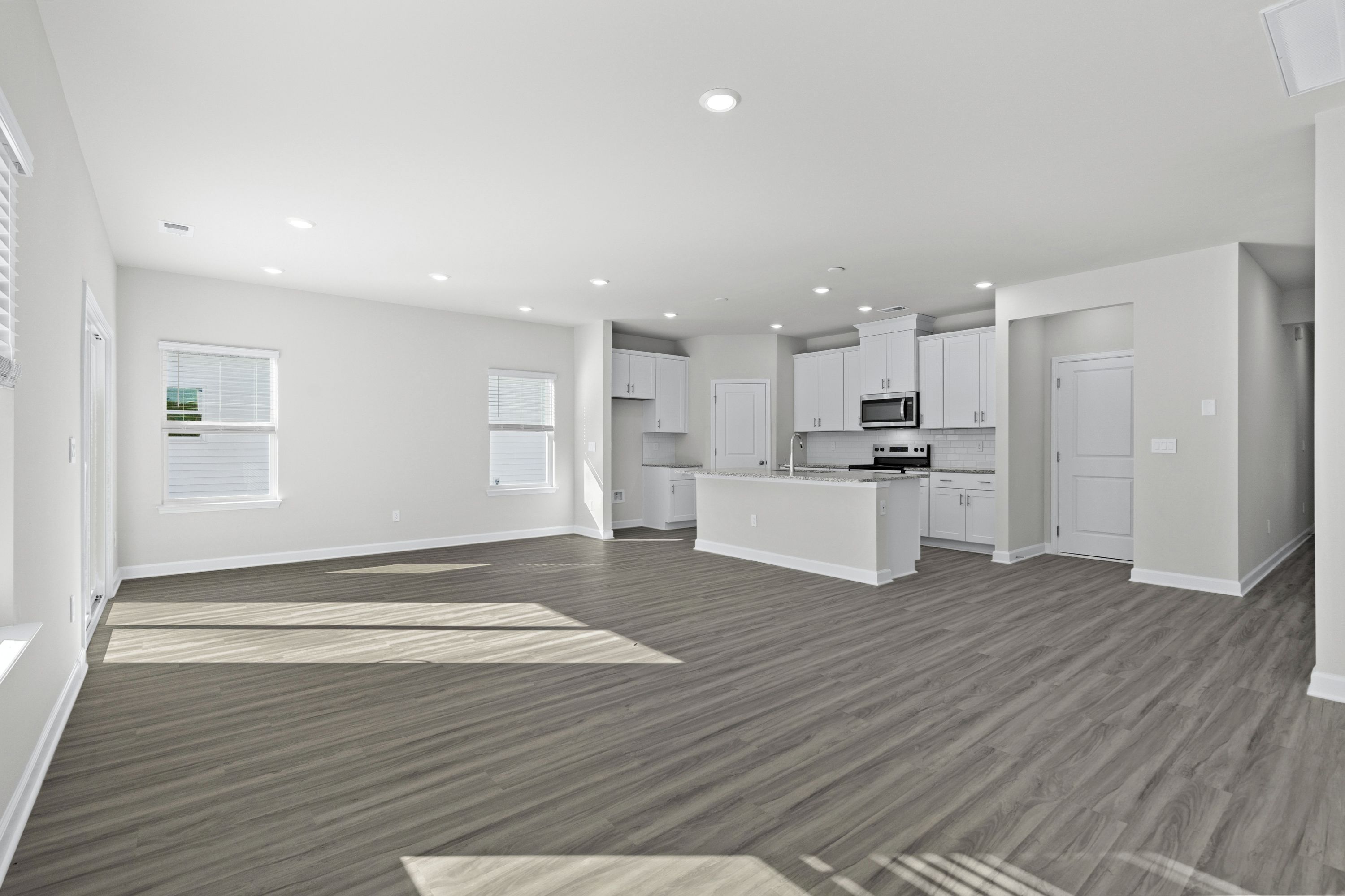 The kitchen overlooks the dining area and great room.