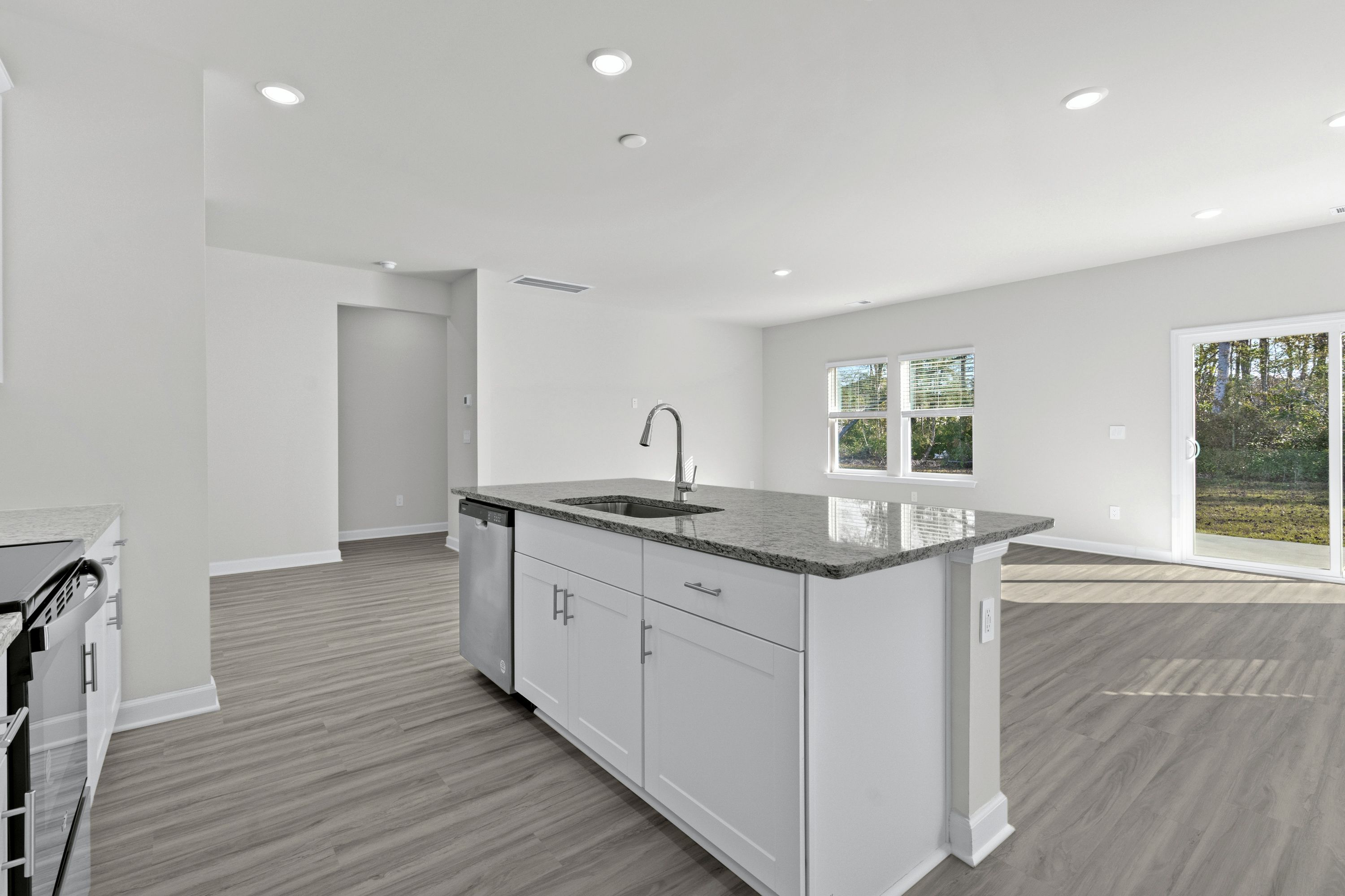 The stunning open-concept floorplan allows for easy flow between the kitchen and dining areas.