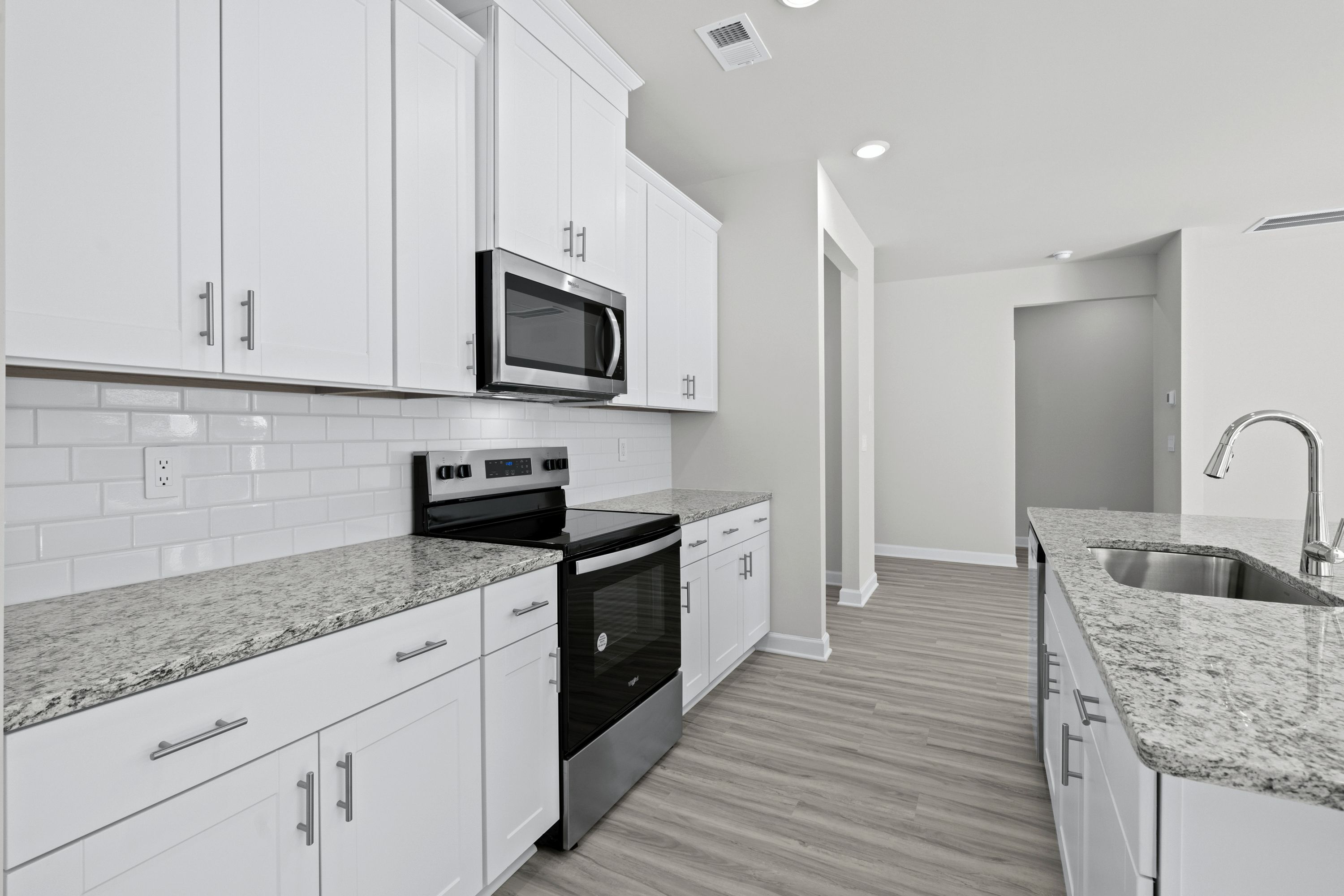 The well-appointed kitchen features plenty of counter space to make meal prep a breeze.