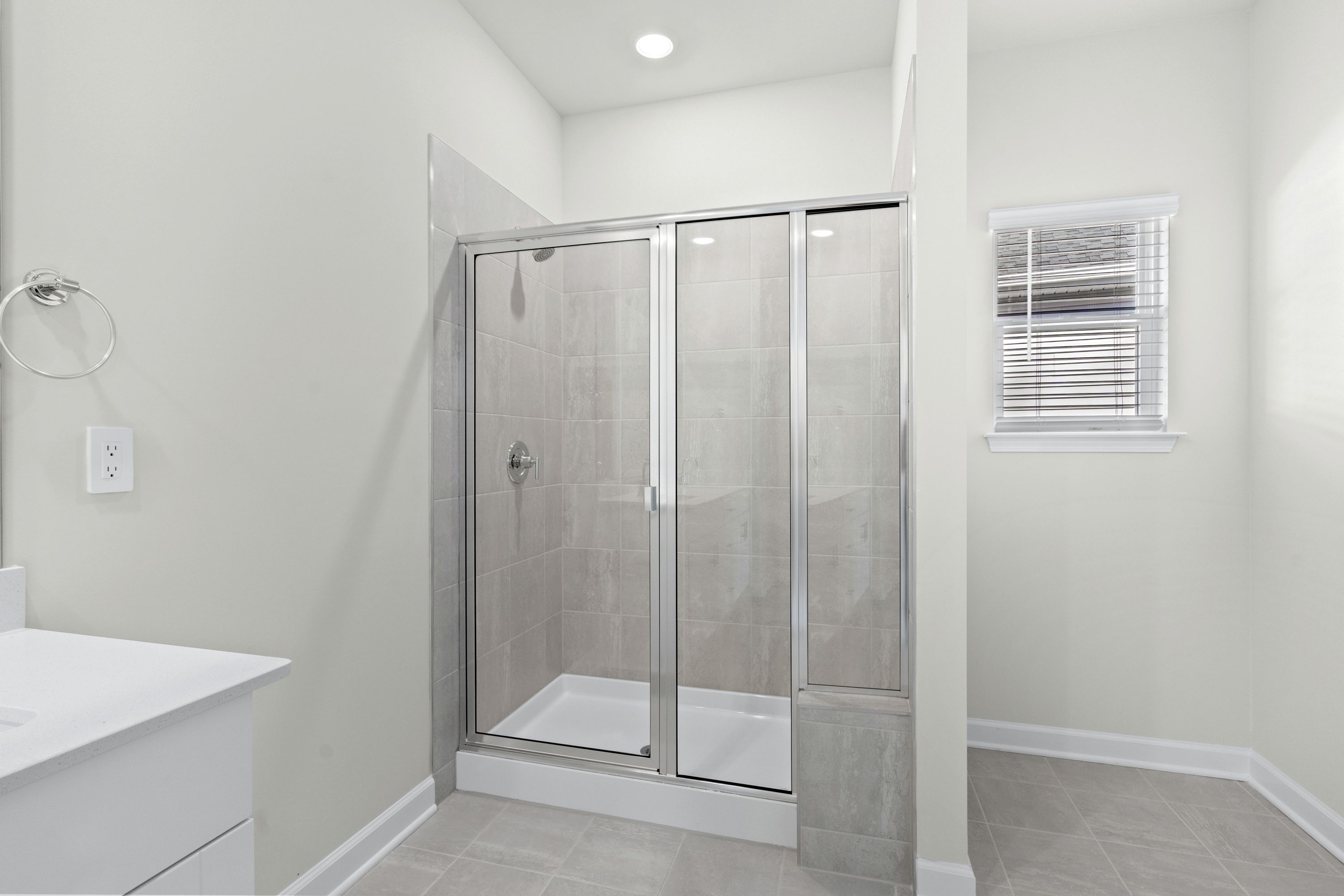 The primary ensuite boasts duel sinks, tile shower and large walk-in closet.