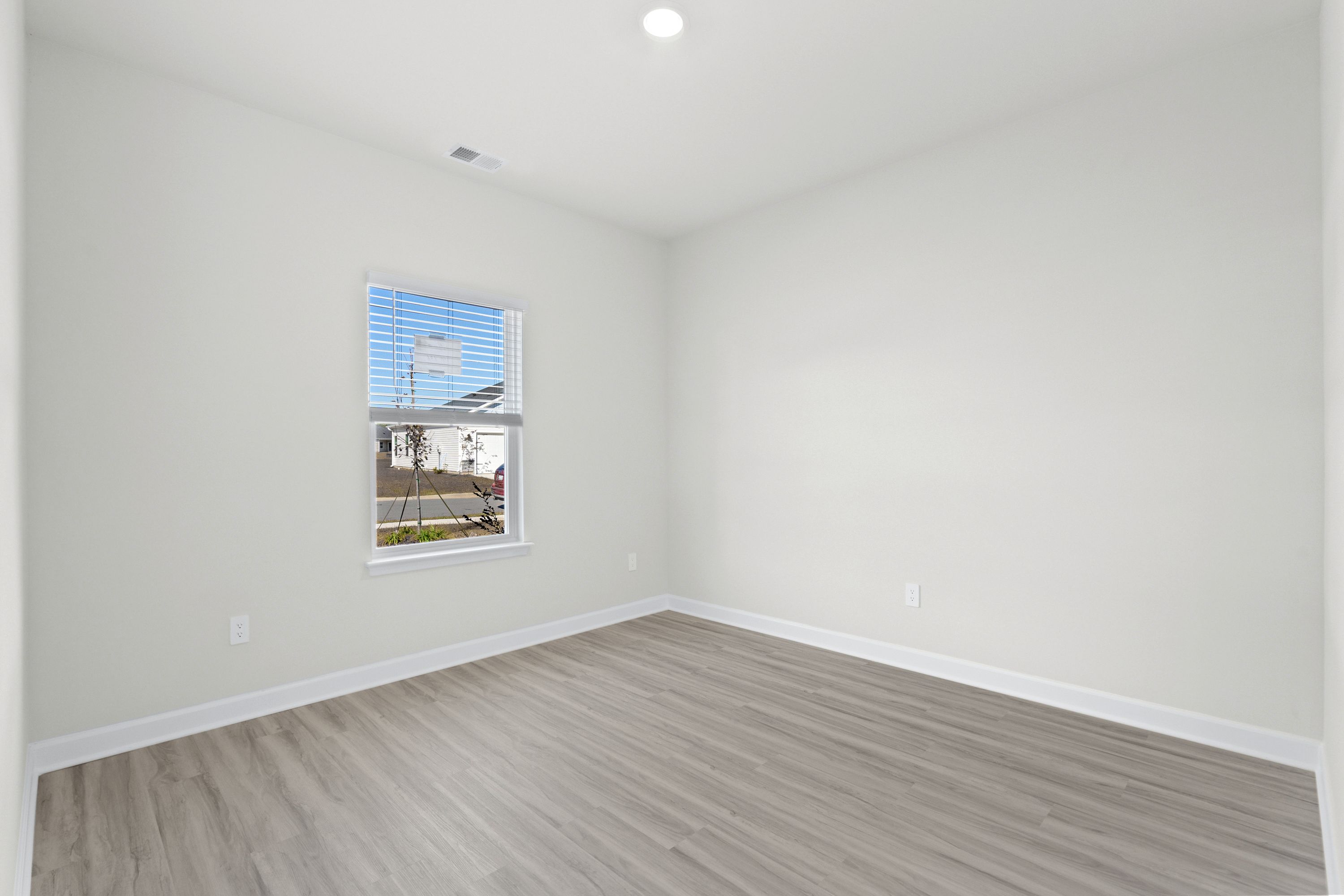 A versatile flex space is perfect as a home office or hobby area.