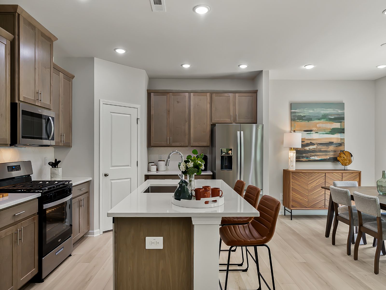 The kitchen provides ample prep and storage space with a sizeable island overlooking the great room.