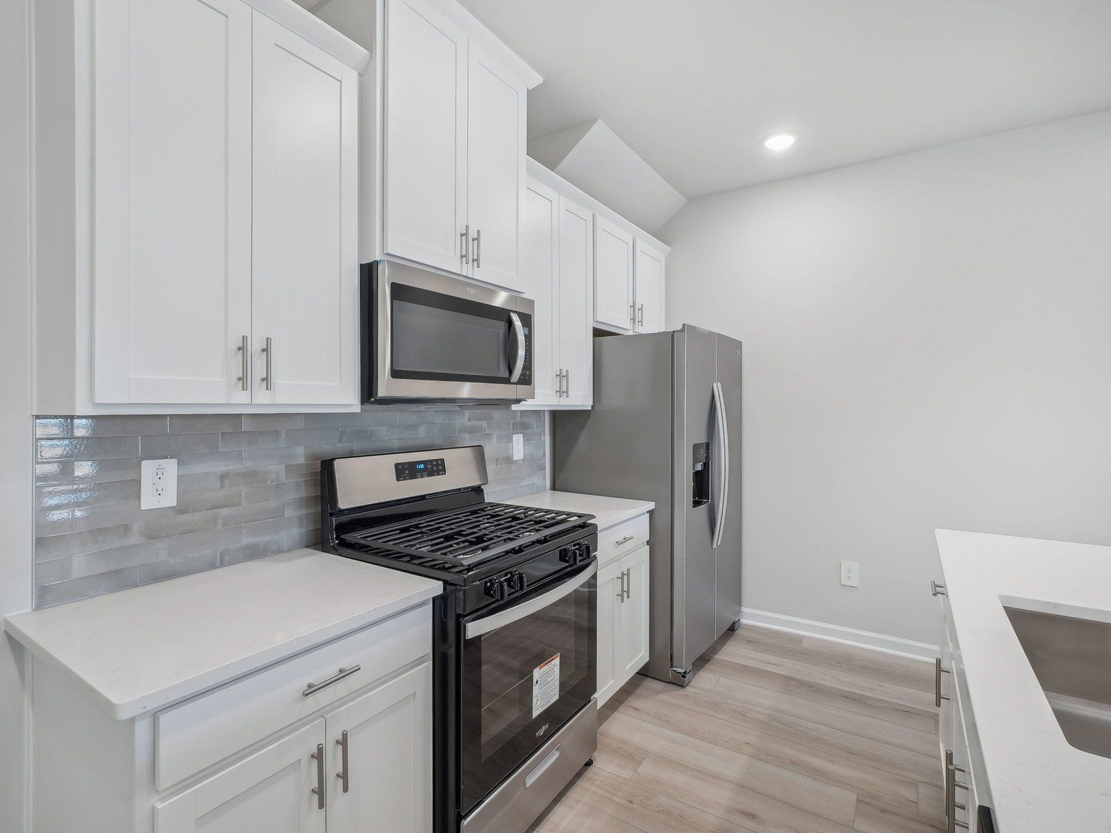 A sizeable kitchen island overlooks the sprawling great room.