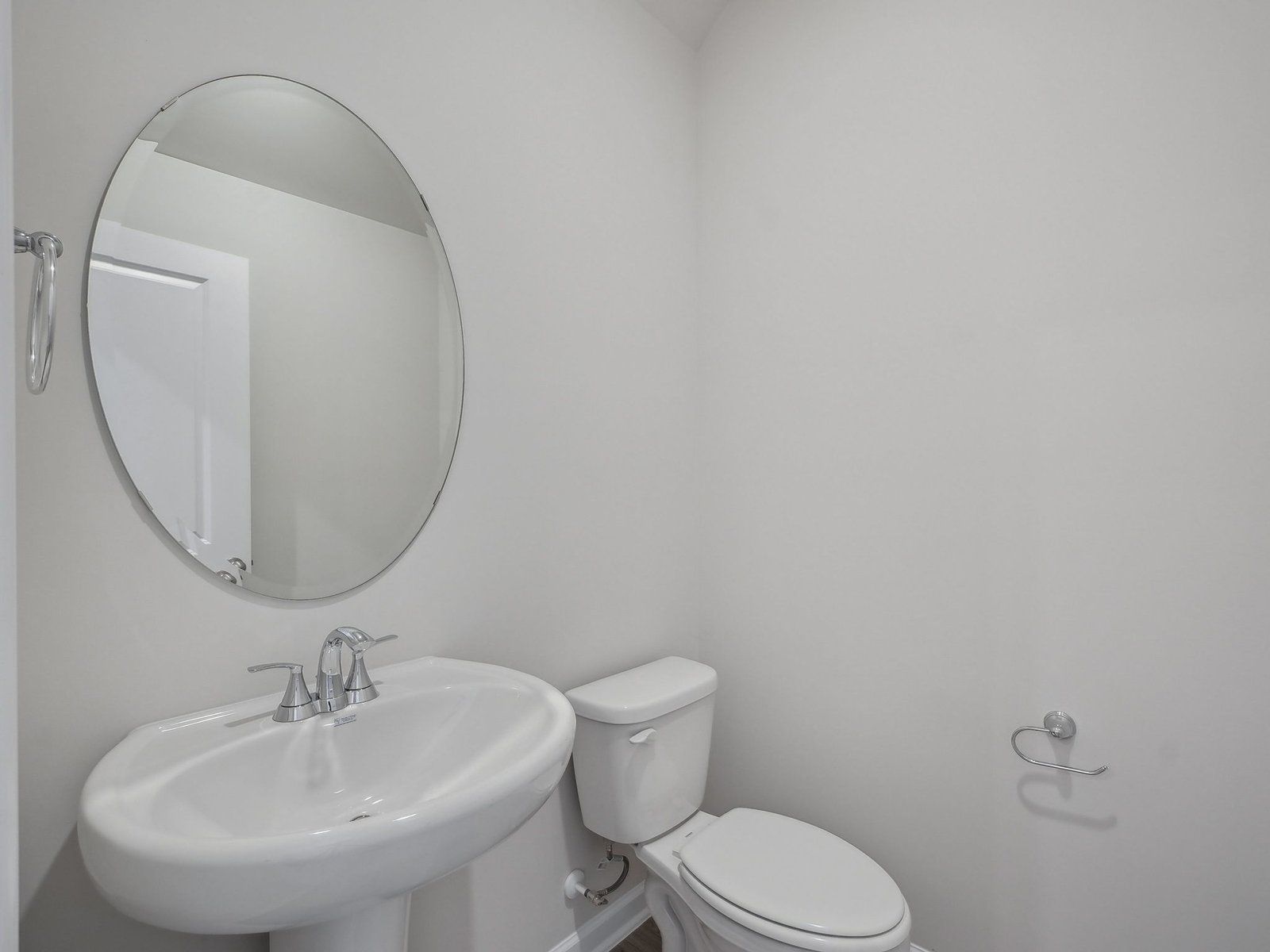 A downstairs half-bath is located near the kitchen.