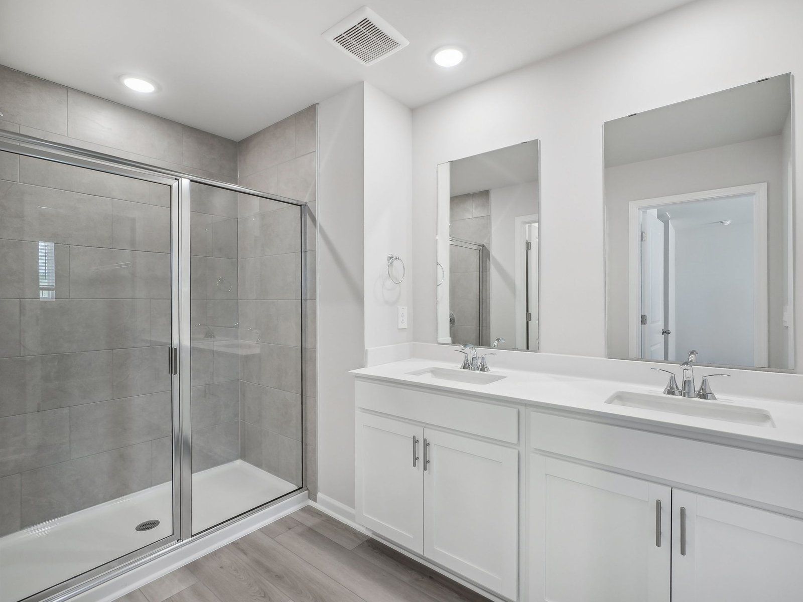 The luxurious primary suite features an ensuite bath with dual sinks and a walk-in closet.