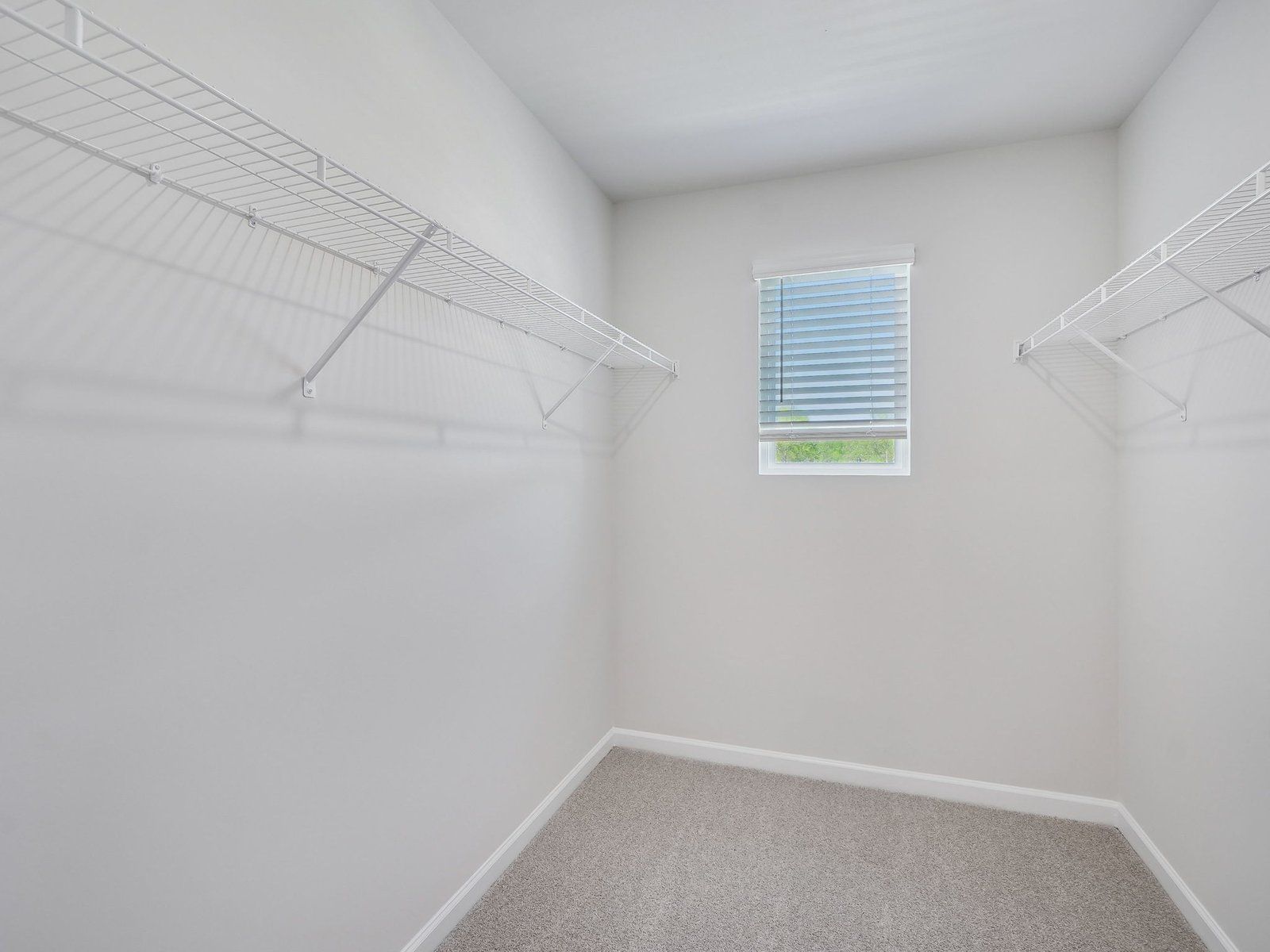 The luxurious primary suite features an ensuite bath with dual sinks and a walk-in closet.