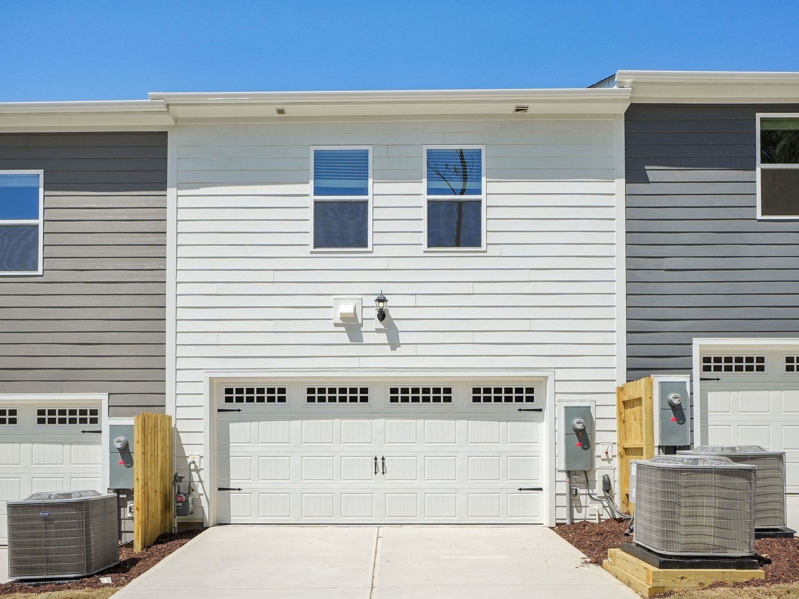 A two-car garage provides plenty of parking and storage space.