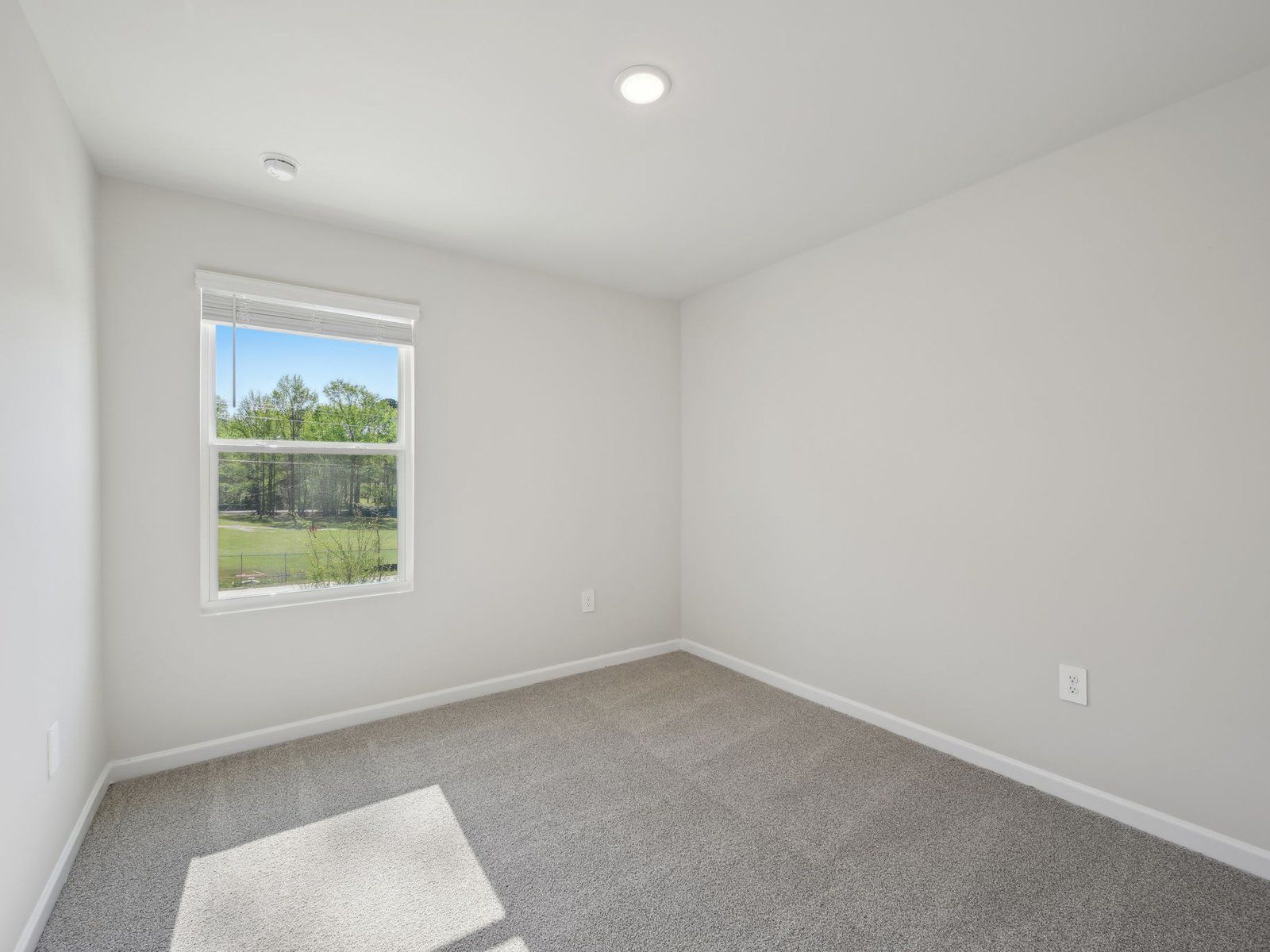 Two secondary bedrooms are ideally situated away from the primary suite.