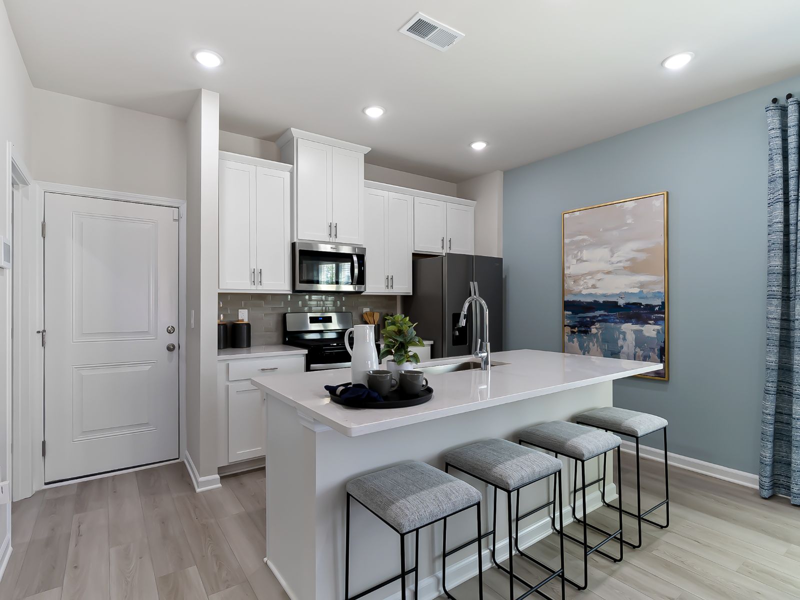 A large kitchen island overlooks the sprawling great room, perfect for entertaining.