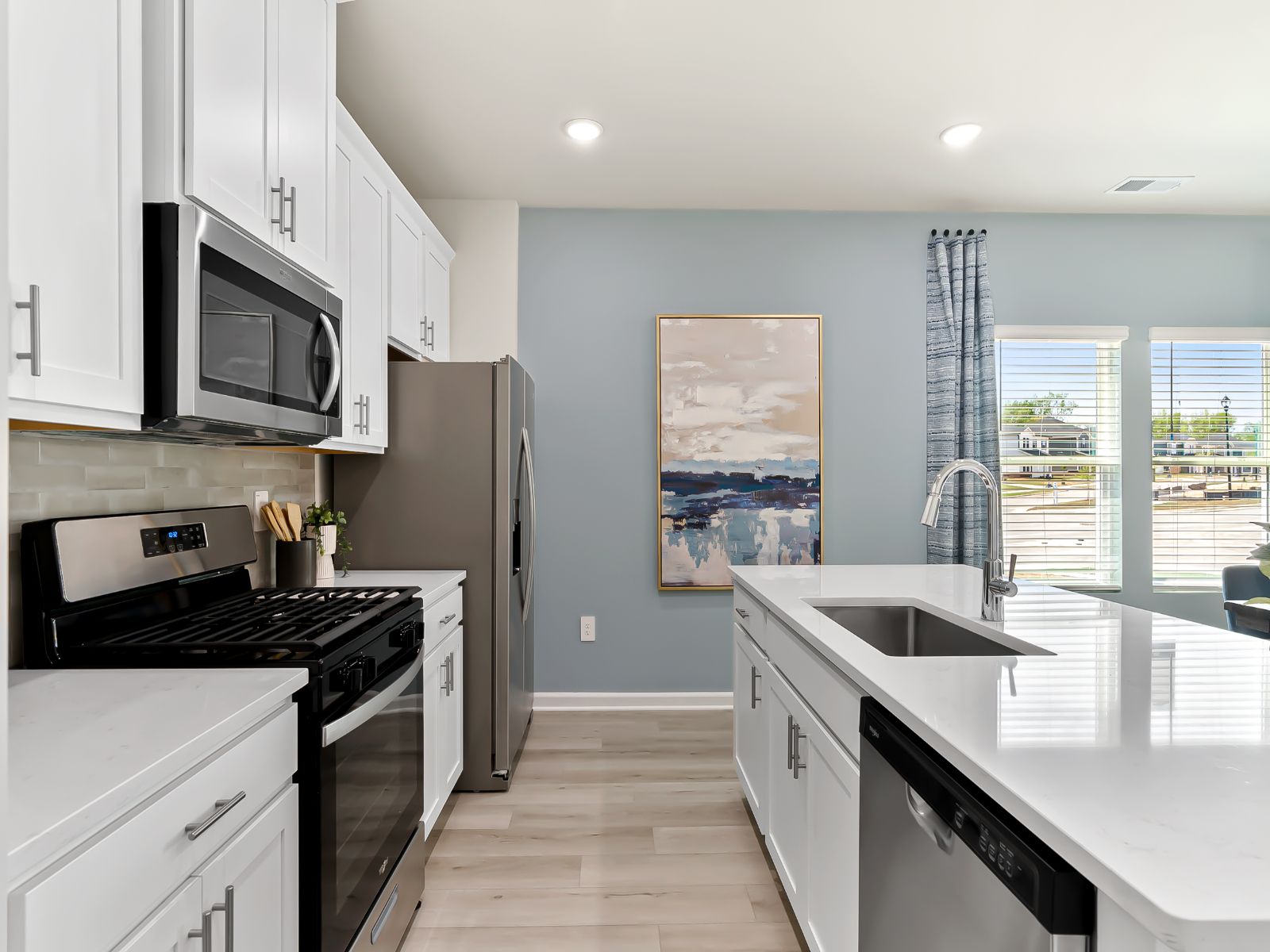 A large kitchen island overlooks the sprawling great room, perfect for entertaining.