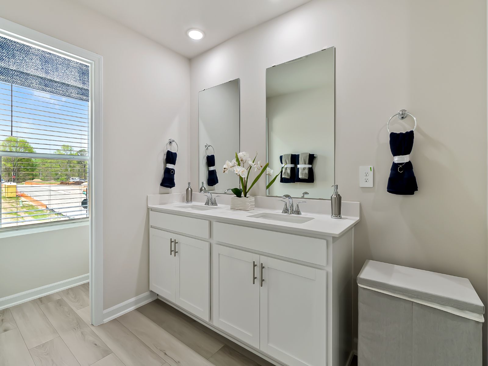 The large primary suite features an ensuite bath with dual sinks and a spacious walk-in closet.
