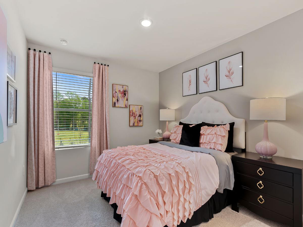 Two secondary bedrooms are ideally situated away from the primary suite.