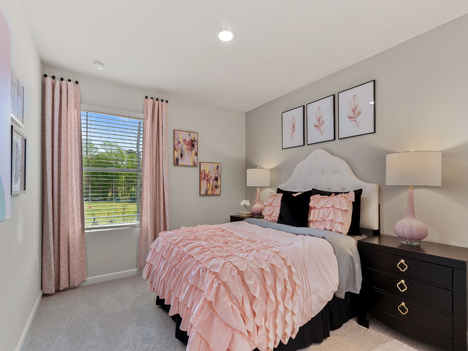 Two secondary bedrooms are ideally situated away from the primary suite.