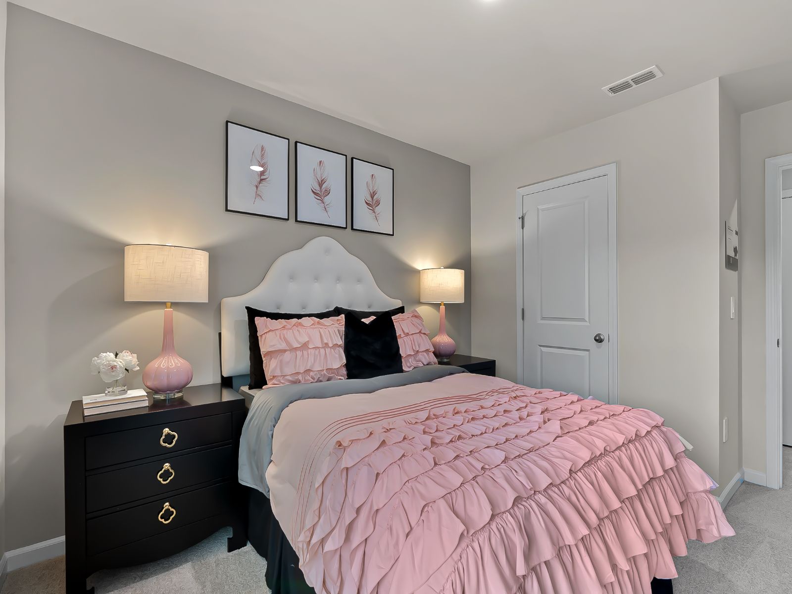 Two secondary bedrooms are ideally situated away from the primary suite.