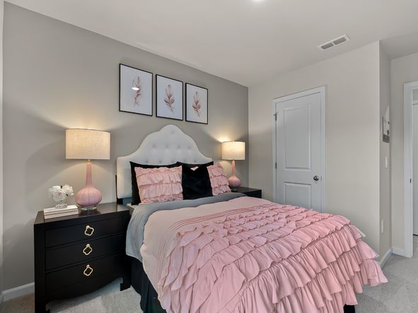 Two secondary bedrooms are ideally situated away from the primary suite.