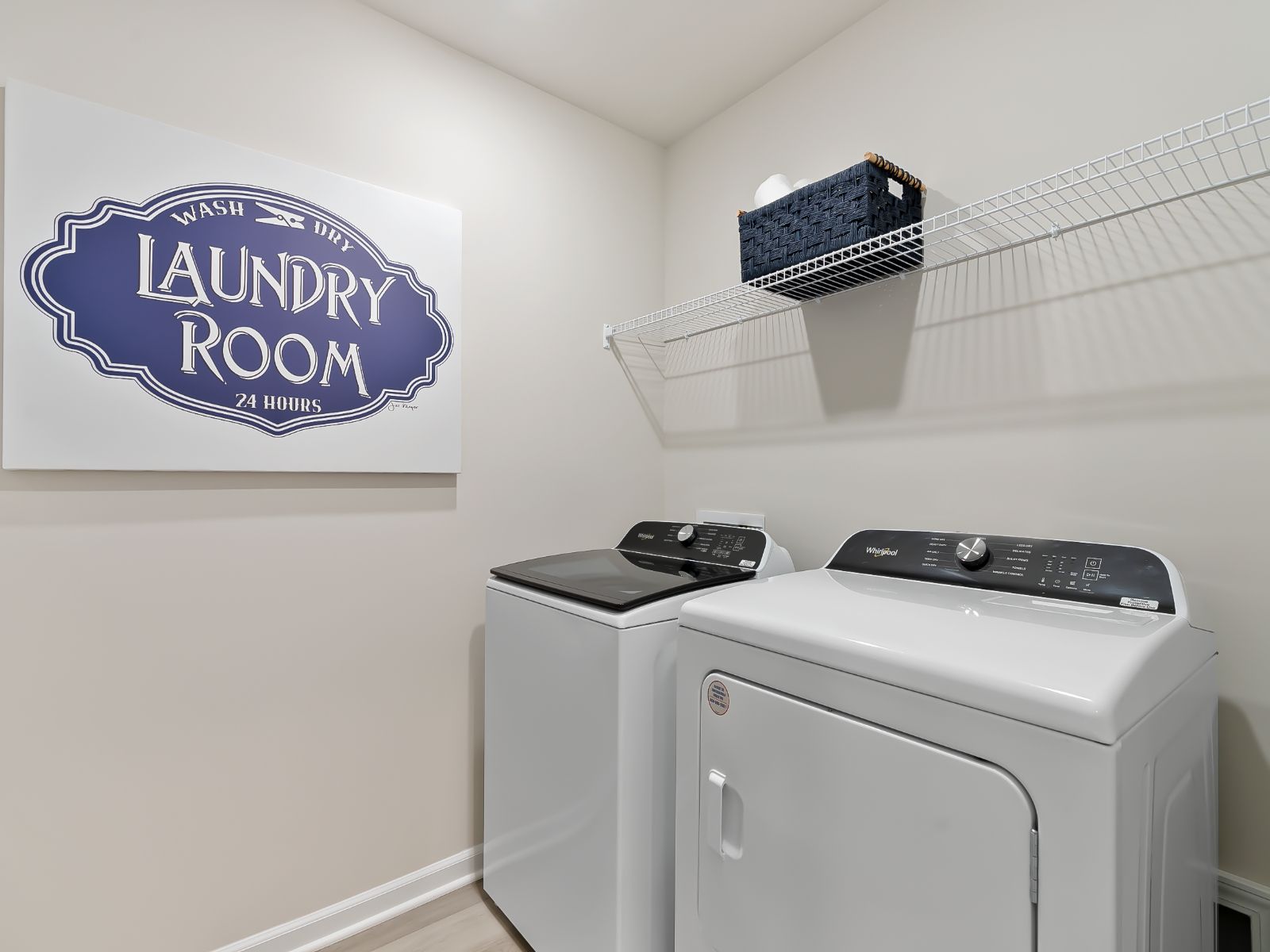 The upstairs laundry room is tucked away from the primary suite.
