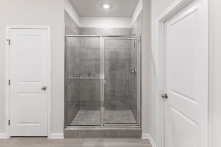 The Gibson floorplan features a walk-in shower in the primary bedroom.
