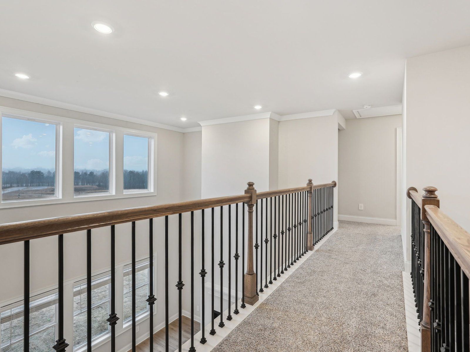 The view from the upstairs overlooks into the living room.