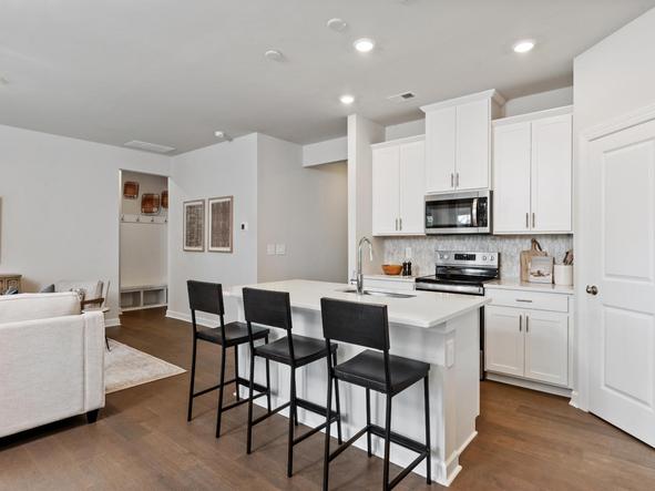 The sleek, modern kitchen makes meal-prep a breeze.