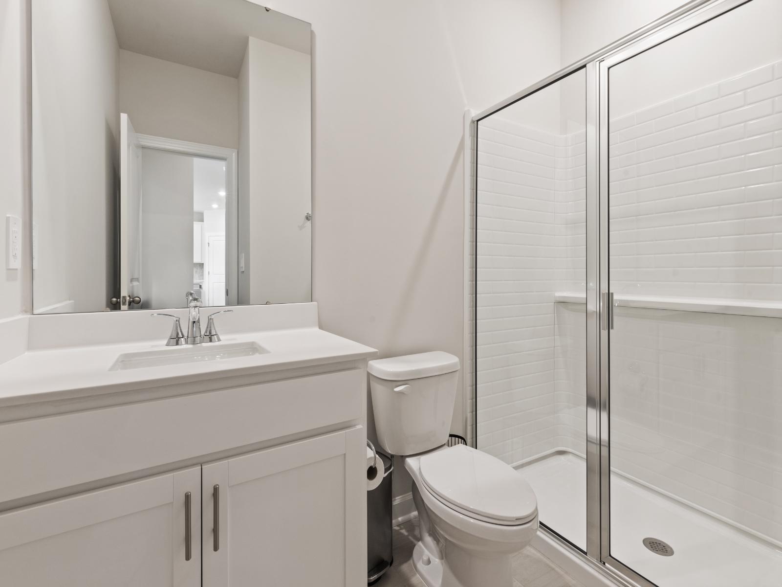 This secondary bathroom is perfect for guests and visitors.