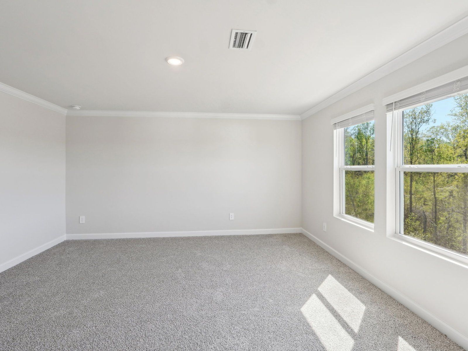 The primary bedroom includes a modern private en-suite.