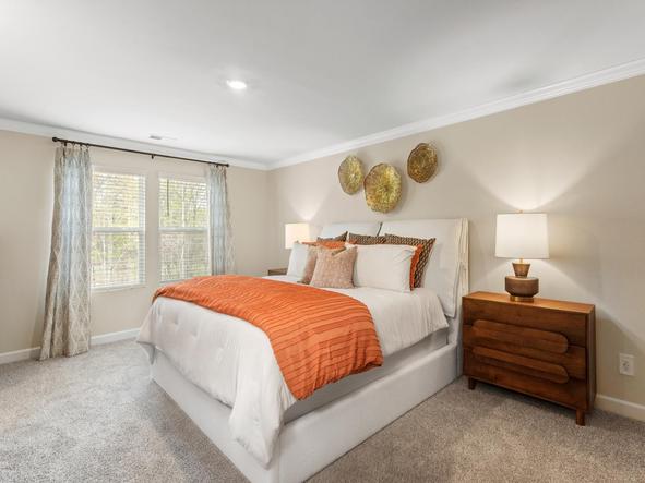 The spacious primary bedroom is the best spot to relax and unwind.