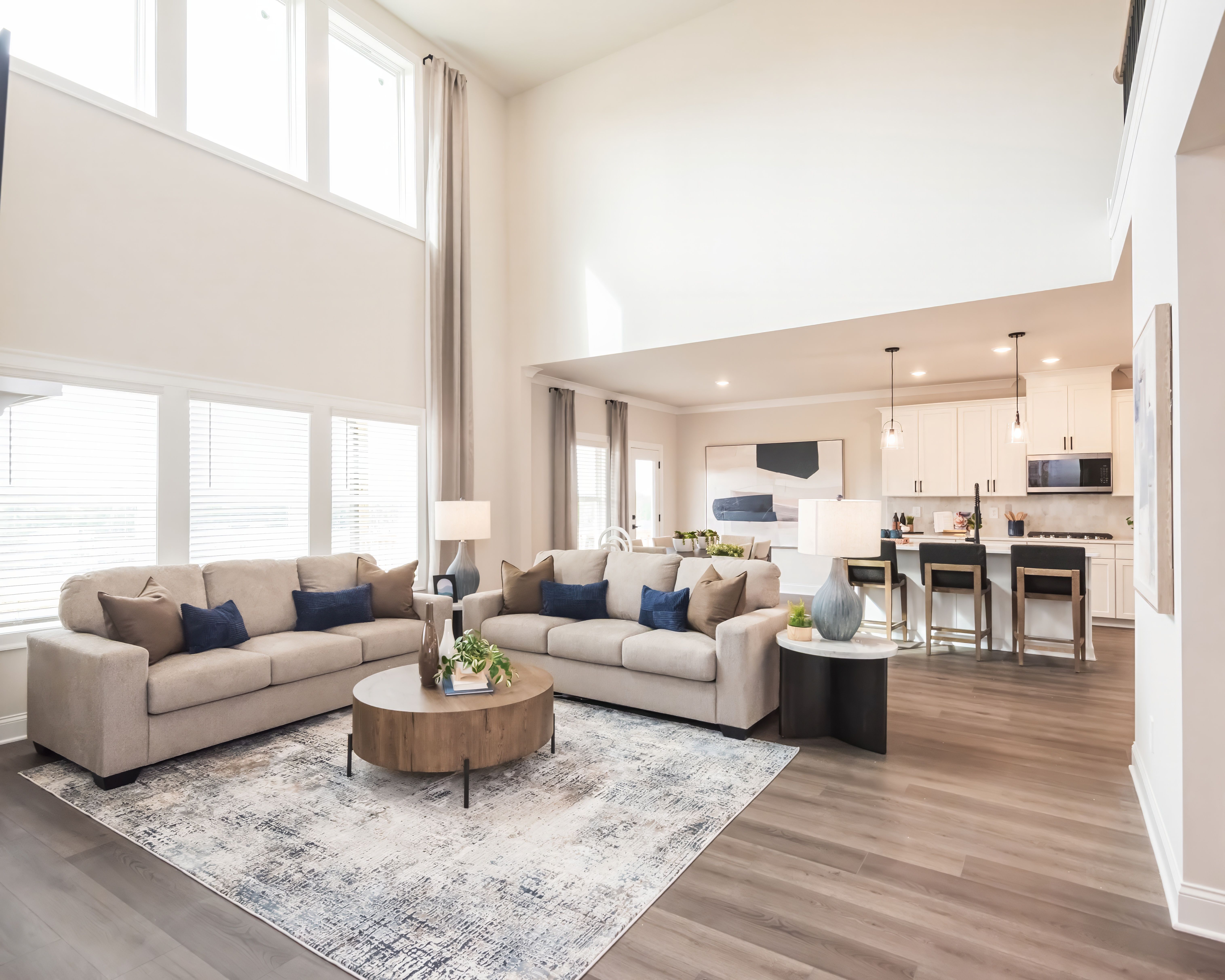 Prepare dinner in the kitchen while watching the kids play in the living room.