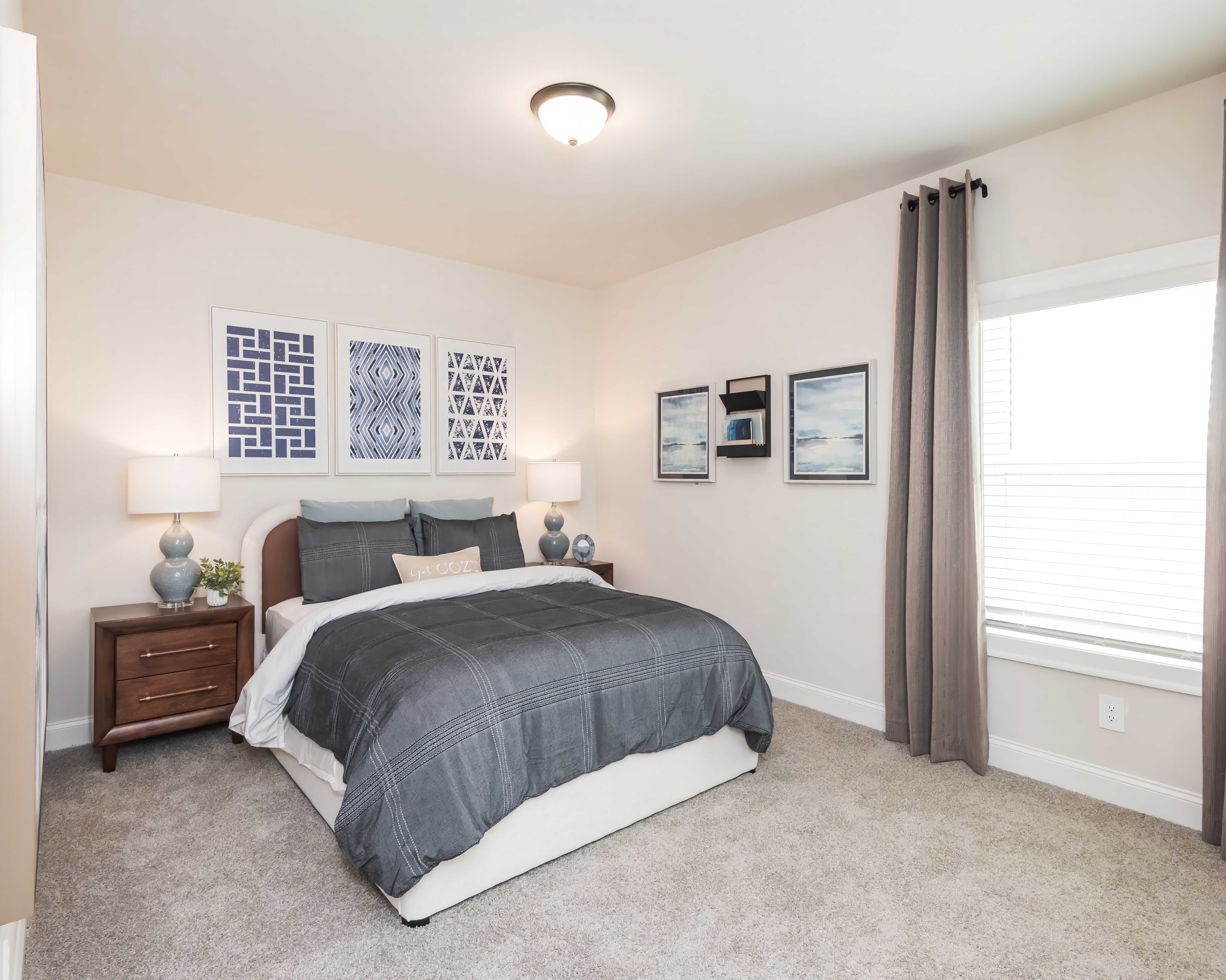 A secondary bedroom on the main level is perfect for guests.