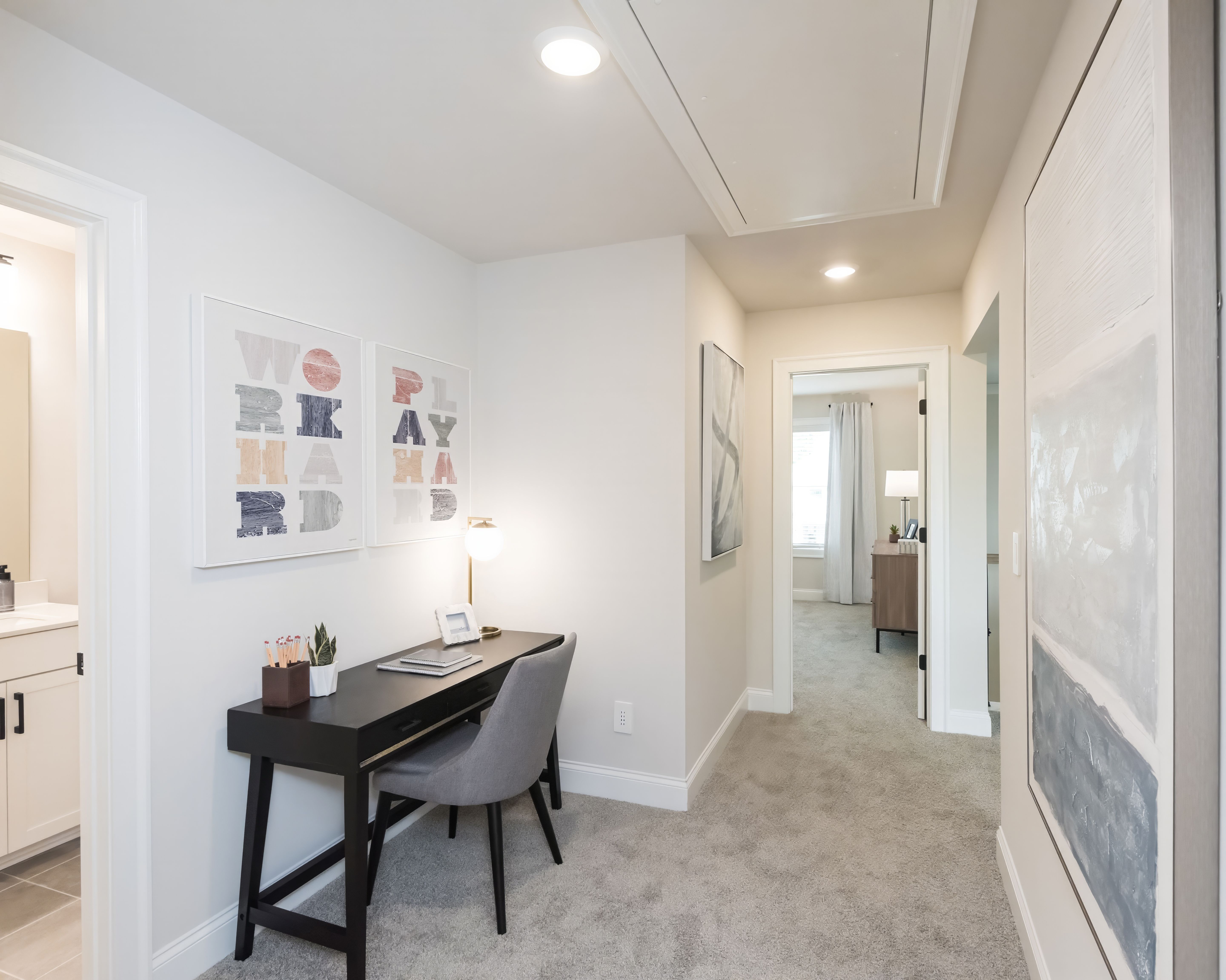 The upstairs hallway features a flexible space for a work space or extra storage.