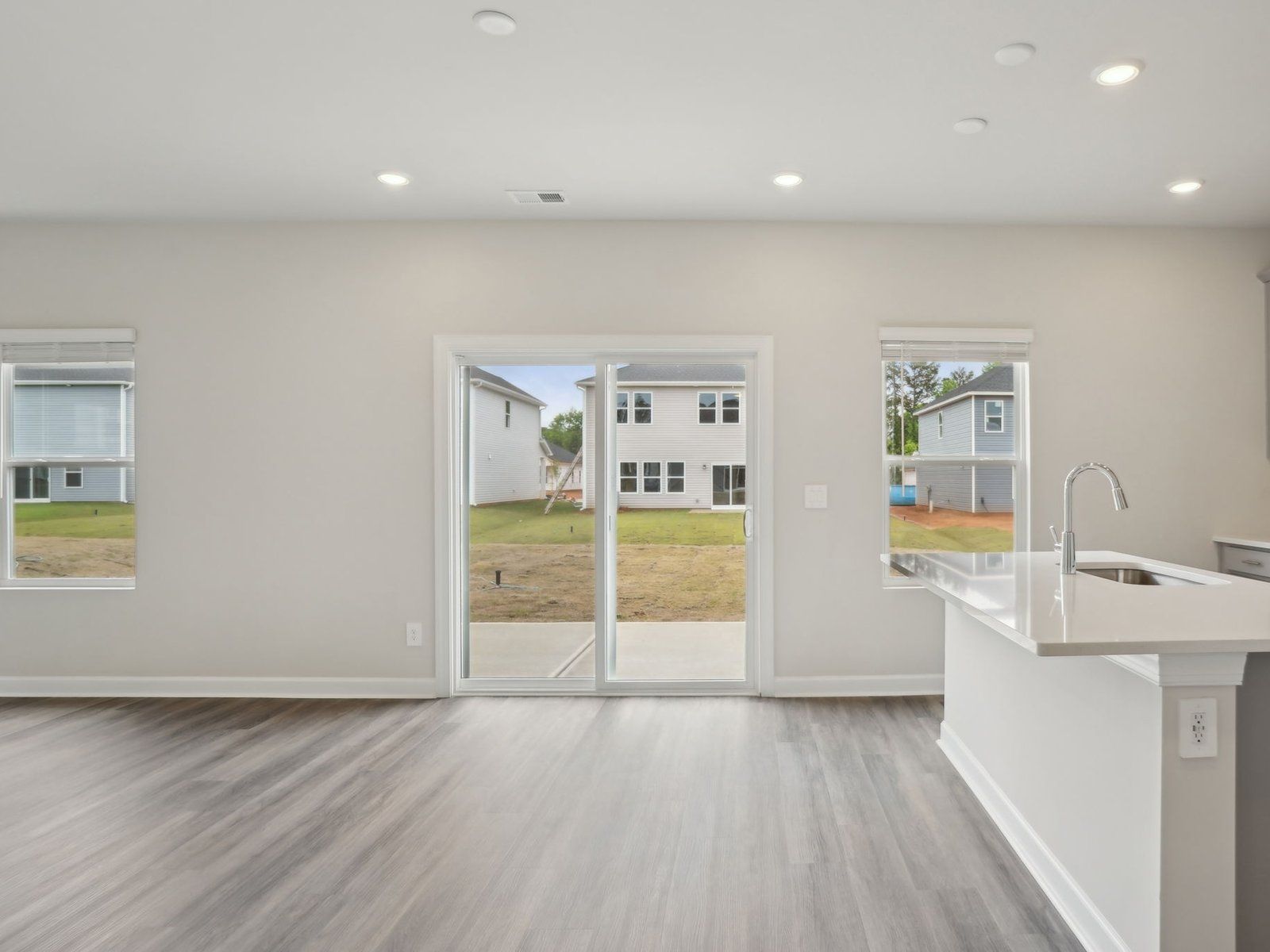 The kitchen and great room offer an abundance of natural light.