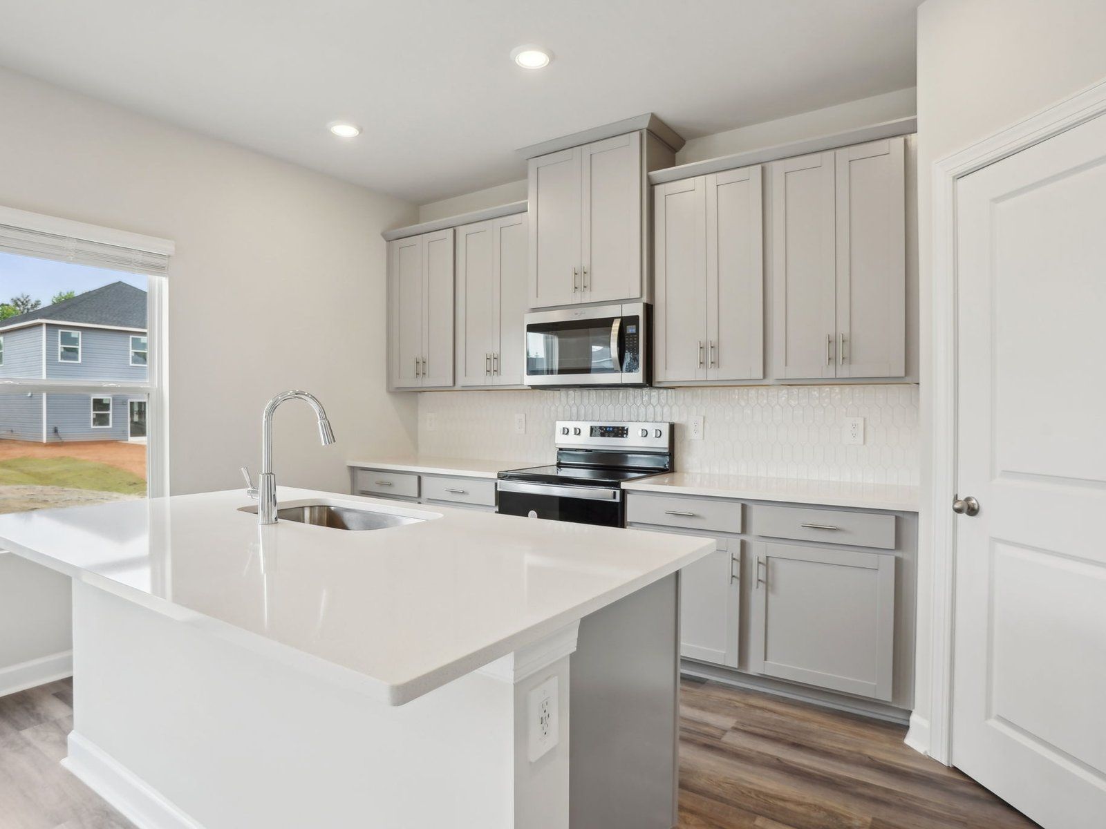 The kitchen's oversized counter island makes meal-prep much easier.