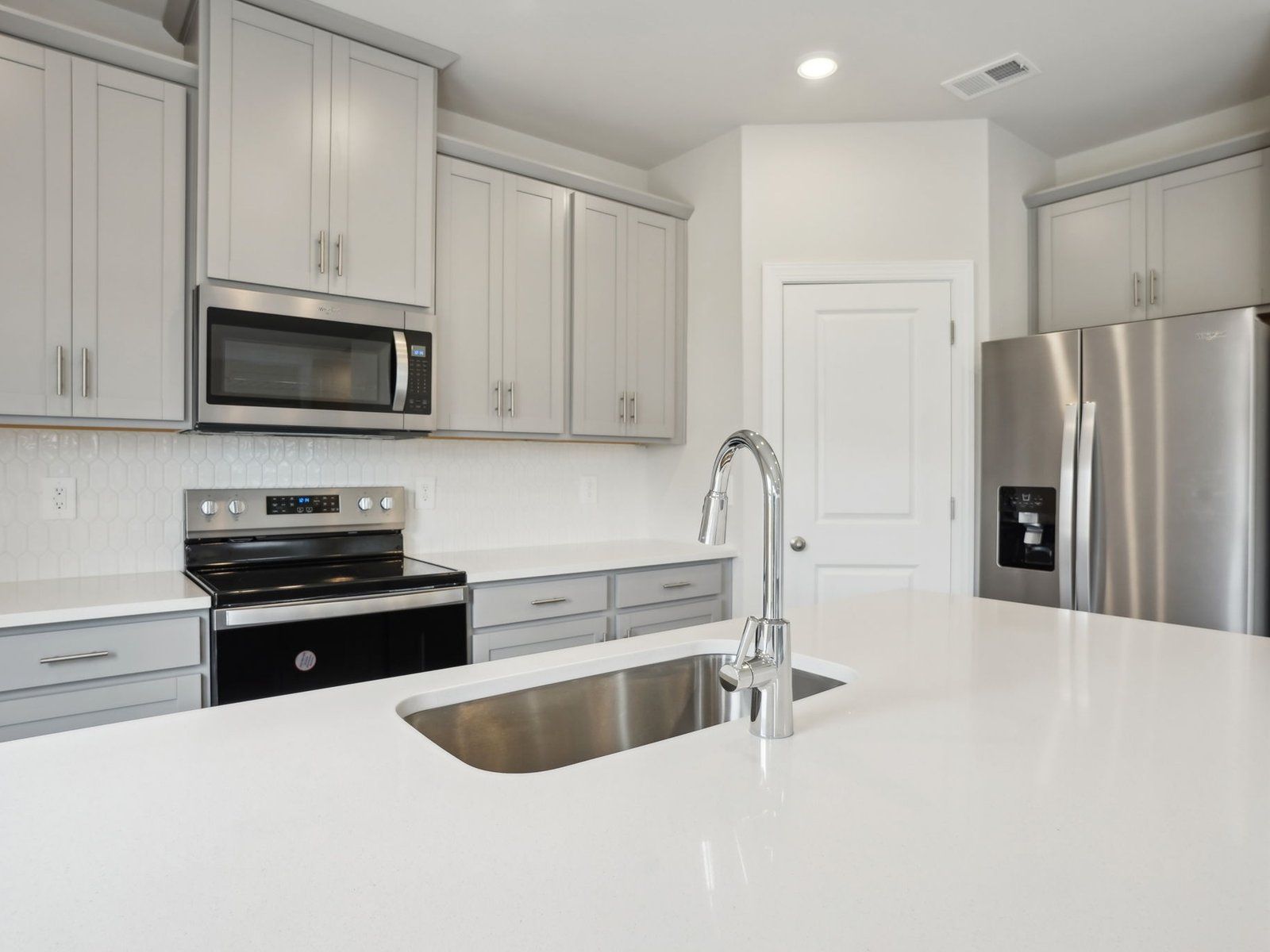 Cook your favorite meals in the sleek, modern kitchen.