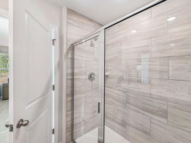 The spacious primary suite features a large walk-in closet and an ensuite bath.