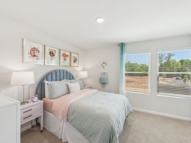 Two secondary bedrooms share a connected bathroom with dual sinks.