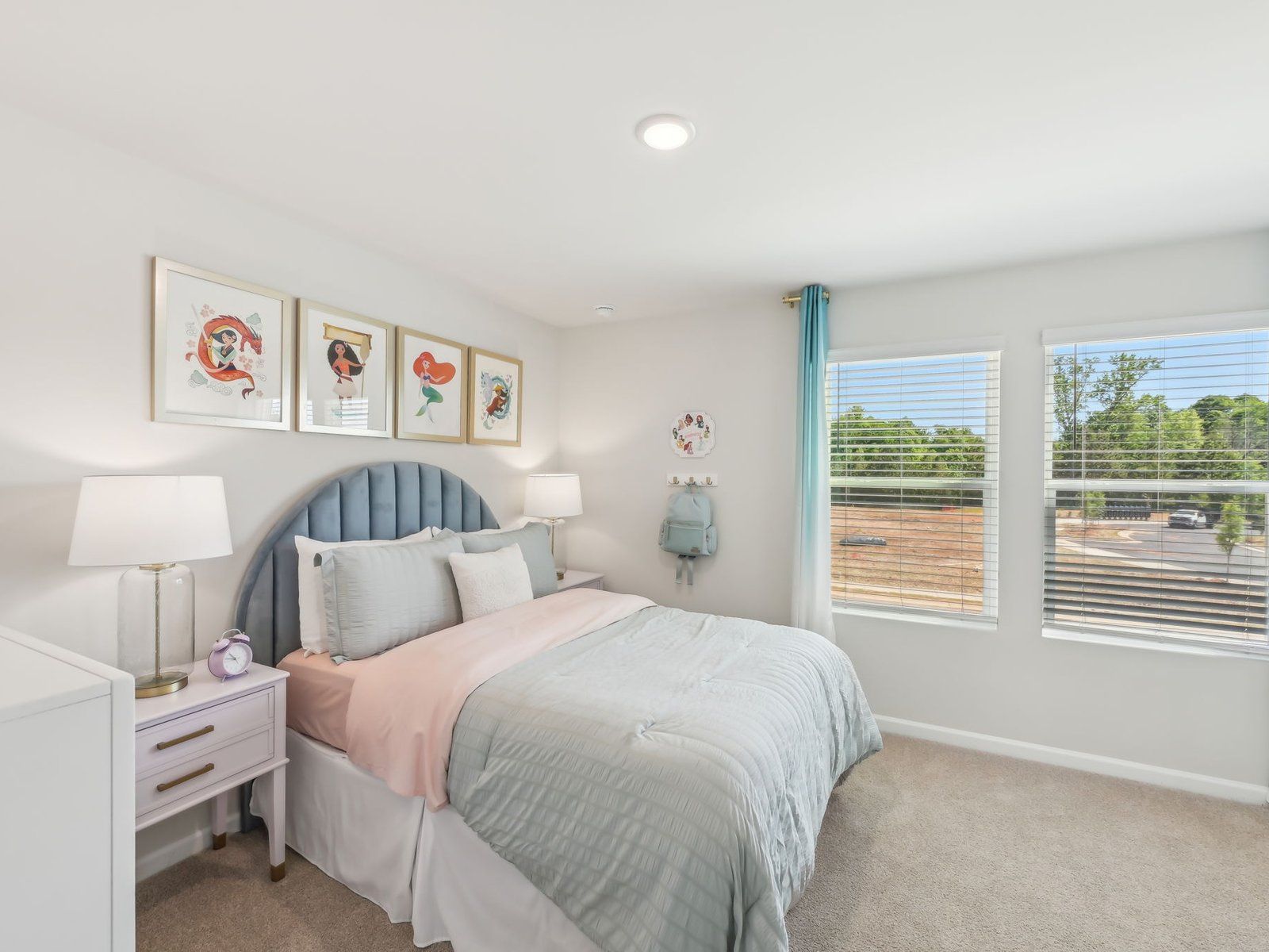 Two secondary bedrooms share a connected bathroom with dual sinks.