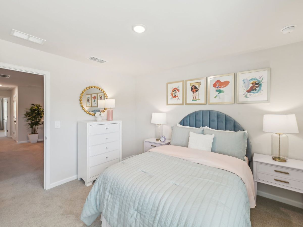 Two secondary bedrooms share a connected bathroom with dual sinks.