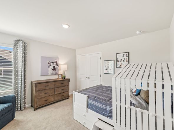 Two secondary bedrooms share a connected bathroom with dual sinks.