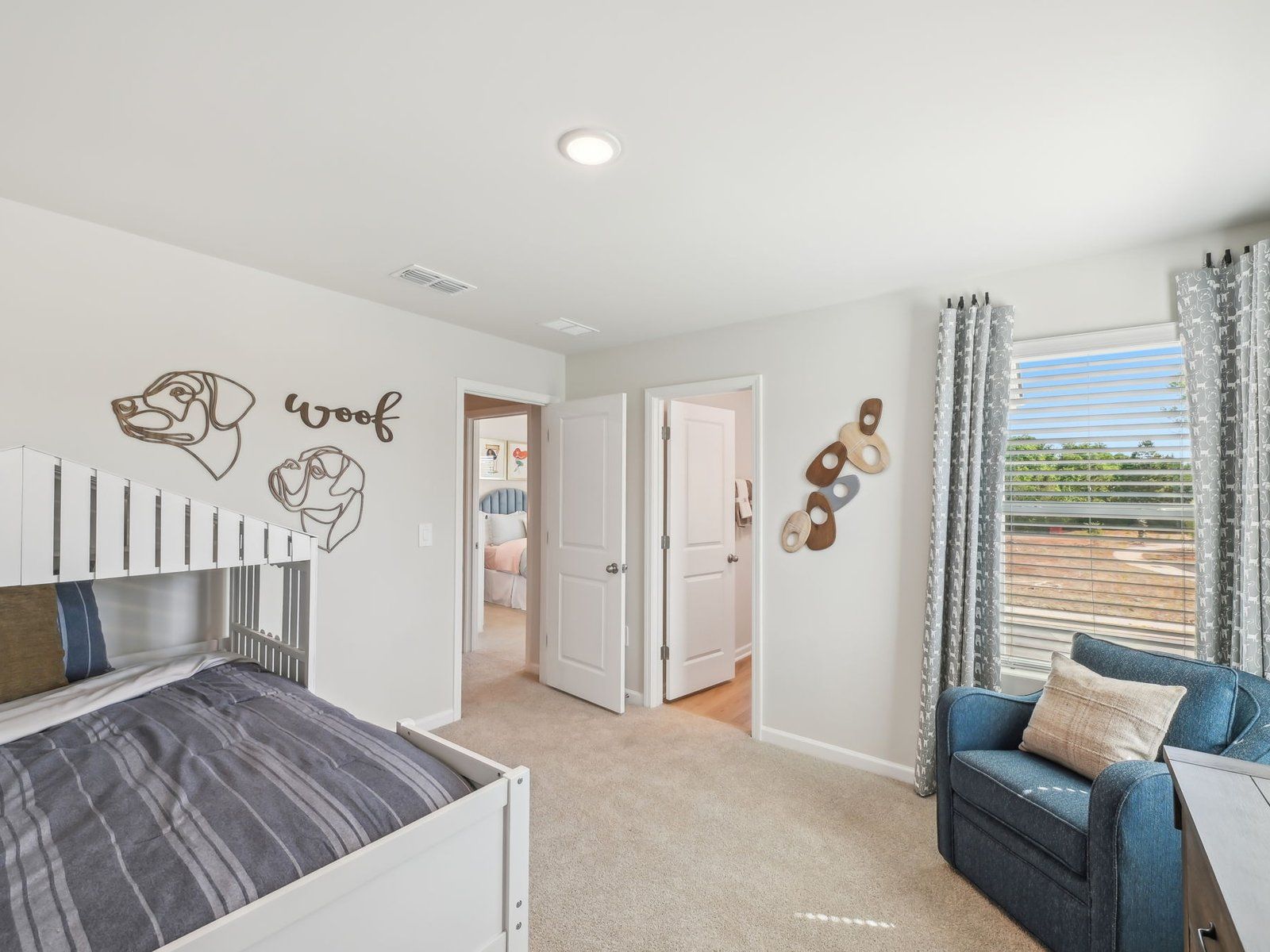 Two secondary bedrooms share a connected bathroom with dual sinks.