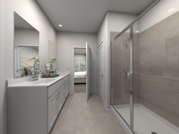 The primary bathroom offers dual vanity sinks and a walk-in shower.